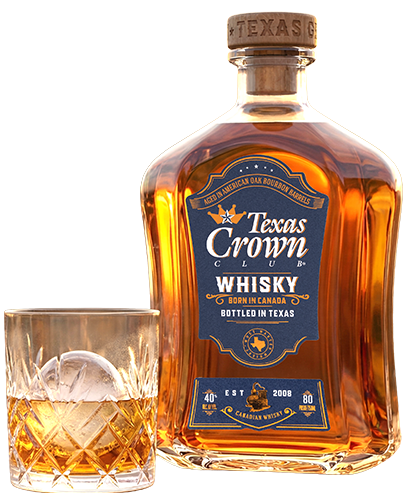 bottle of Texas Crown Club whisky next to a low ball glass of whisky