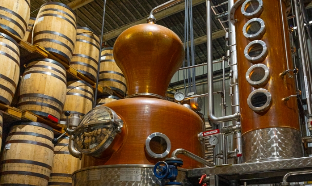 whisky distillery detail with barrels - Texas Crown Club story